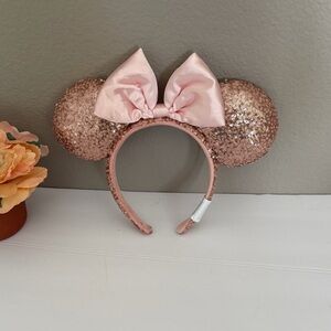 Disney Parks Minnie Mouse ears with rose gold sequins and a pink bow